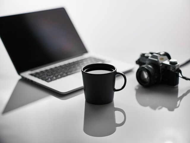 focused european professional deep work on laptop dark minimalist desk